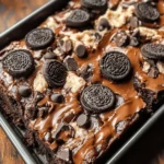 If you’re on the hunt for a dessert that dazzles with flavor and texture, look no further than our Cookie Dough Oreo Brownies. This mouthwatering treat is a dream come true for dessert lovers, seamlessly combining the fudgy richness of brownies with the creamy indulgence of edible cookie dough, all topped off with crunchy chunks of Oreo cookies. Whether you're throwing a party, celebrating a special milestone, or simply indulging in a sweet craving, these brownies are guaranteed to be a hit.
