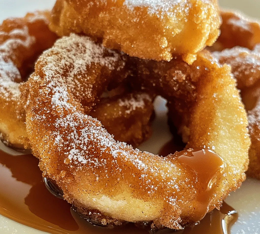 Fried Cinnamon Apple Rings are a delightful treat that perfectly combines the crispness of apples with the warm sweetness of cinnamon and sugar. This delectable recipe is not only a feast for the taste buds but also a visual delight, with golden-brown rings that beckon you to take a bite. The warm, gooey texture of the apples, enveloped in a lightly crispy batter, creates a satisfying contrast that is sure to please both children and adults alike. Whether you're looking for a delicious dessert to impress your dinner guests or a comforting snack to enjoy on a cozy afternoon, these fried apple rings are an excellent choice.
